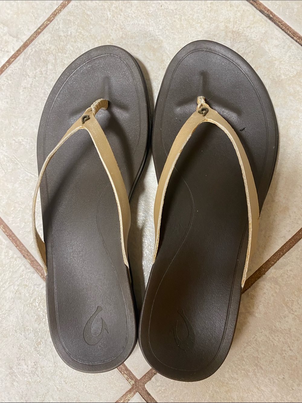OluKai Women's Dark Brown Footbed Flip Flops with Tan/gold Straps